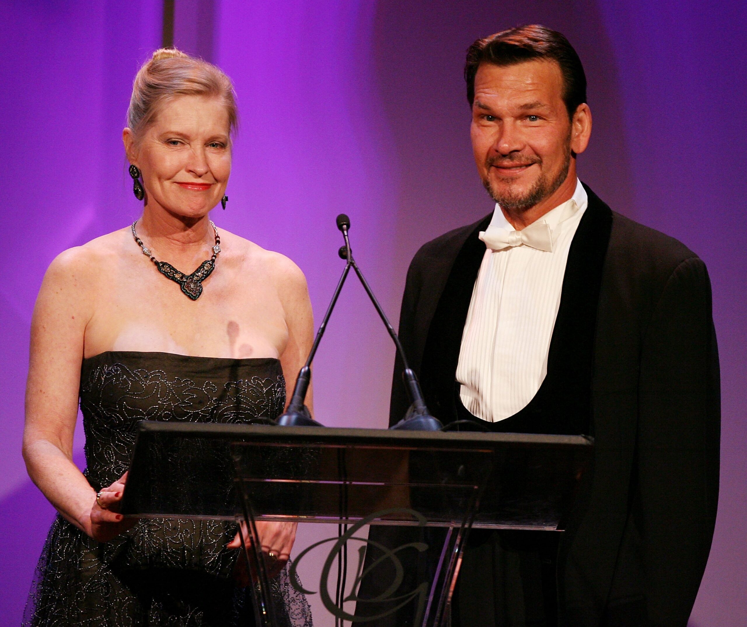 Lisa Niemi (L) and actor Patrick Swayze speak onstage during the 9th annual Costume Designers Guild Awards held at the Beverly Wilshire Hotel on February 17, 2007 in Beverly Hills, California | Source: Getty Images