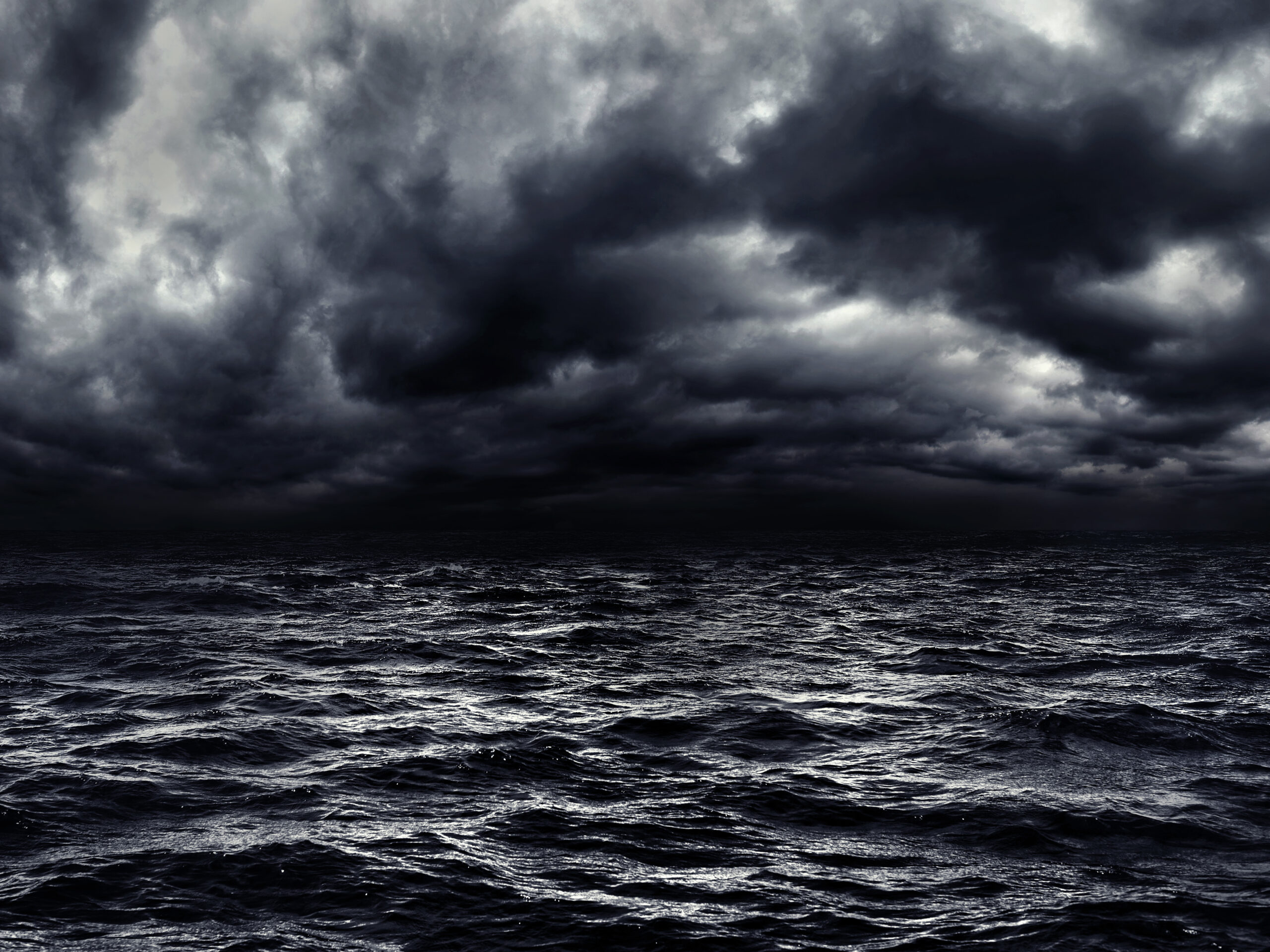 Dark stormy sea with a dramatic cloudy sky. | Source: Shutterstock