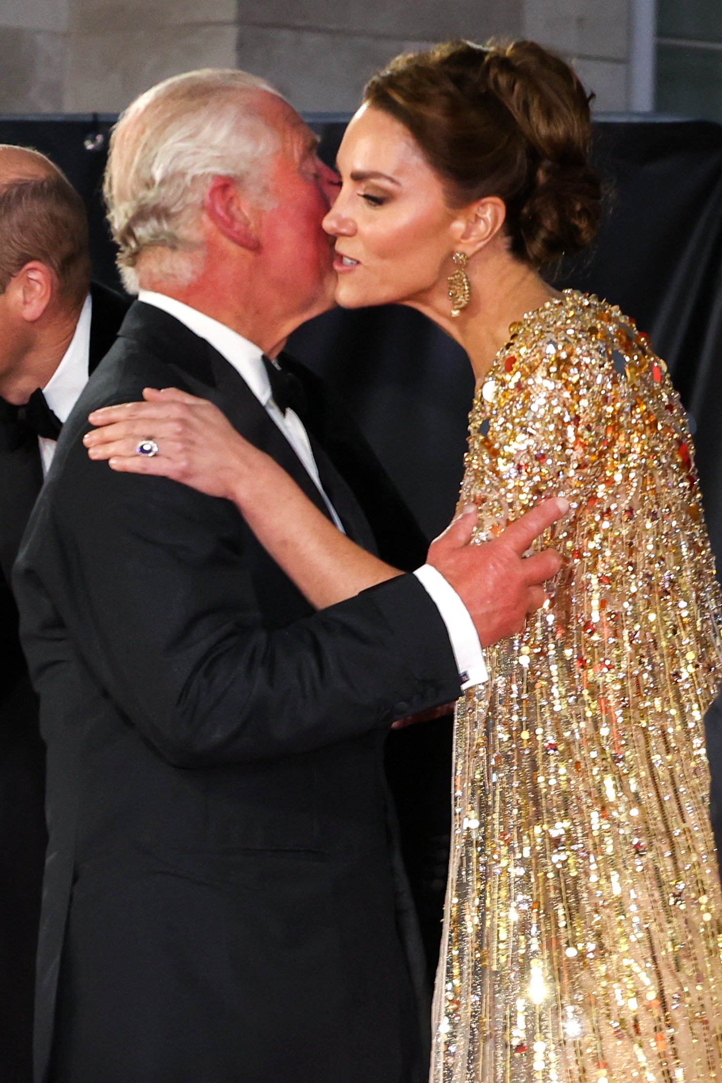 King Charles III kisses the Princess of Wales Kate Middleton at the premiere of the James Bond 007 film "No Time to Die" in West London on September 28, 2021. | Source: Getty Images