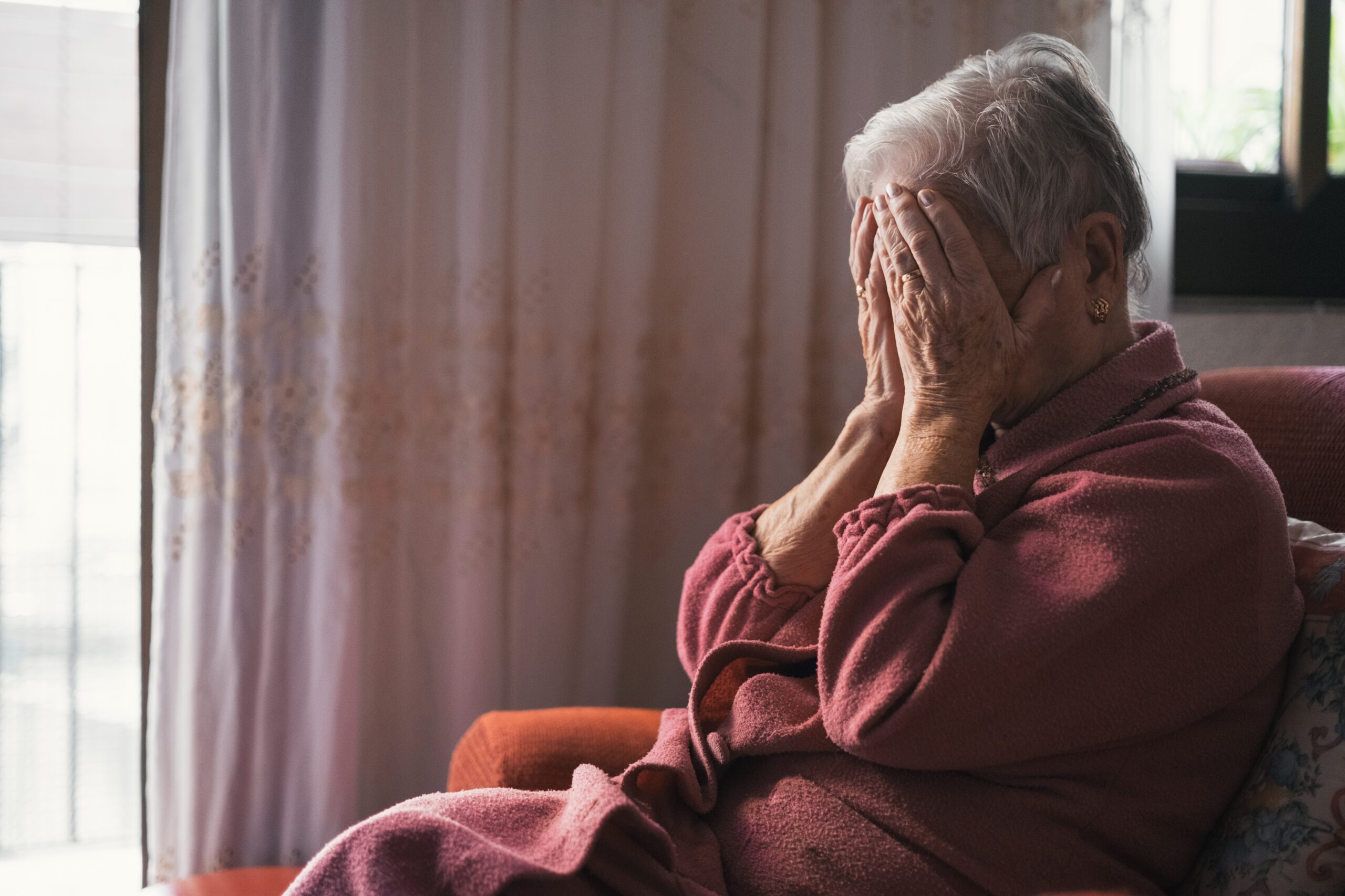 A sad elderly woman | Source: Shutterstock